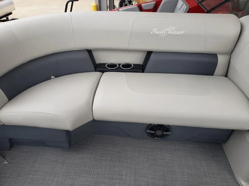 Slide: The Image of 2024 SunChaser Vista 22 LR boat interior with gray seating and cup holders. - 8