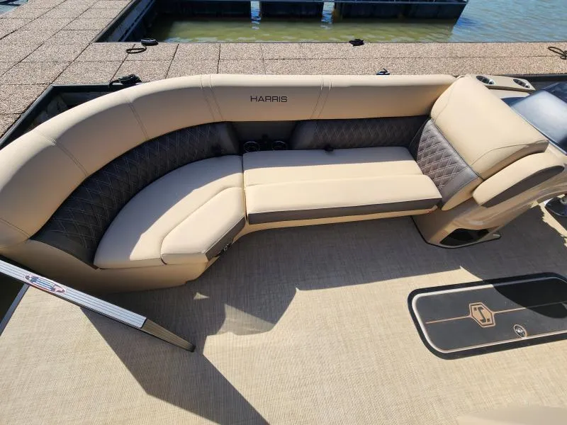 Slide: The Image of 2025 Harris Boats SUNLINER 230 interior with beige seating and elegant design. - 11