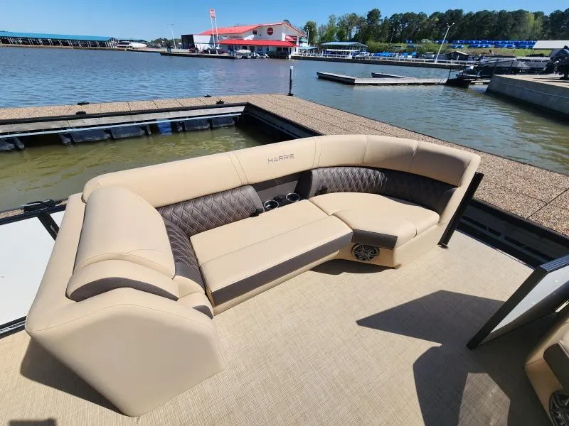 Slide: The Image of Luxurious seating on 2025 Harris Boats SUNLINER 230, docked by a scenic waterfront. - 15