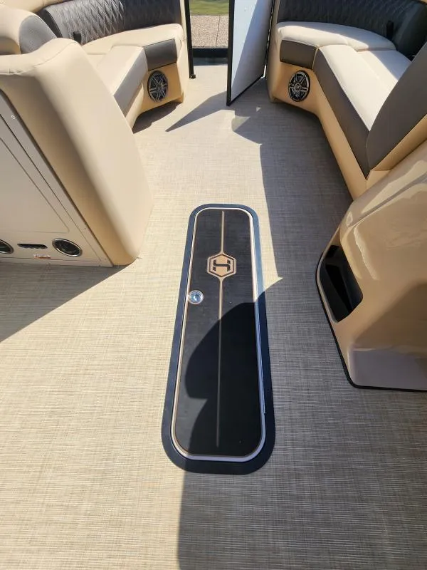 Slide: The Image of 2025 Harris Boats SUNLINER 230 interior with beige seating and stylish flooring. - 20