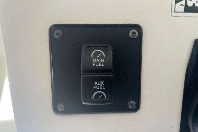 Slide: The Image of Switch panel for main and auxiliary fuel on 2013 Edgewater 388CC boat. - 14