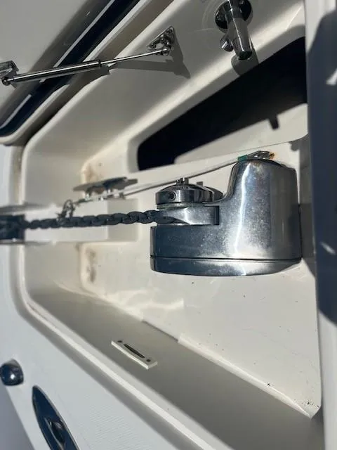 Slide: The Image of 2013 Edgewater 388CC boat anchor chain mechanism in close-up view. - 18