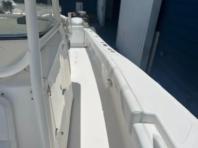 Slide: The Image of 2013 Edgewater 388CC boat deck, showcasing sleek design and spacious layout. - 23