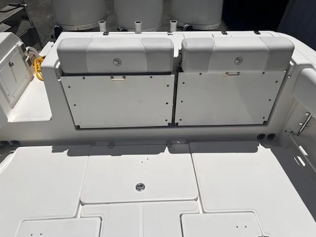 Slide: The Image of 2013 Edgewater 388CC boat deck with storage compartments and seating. - 27