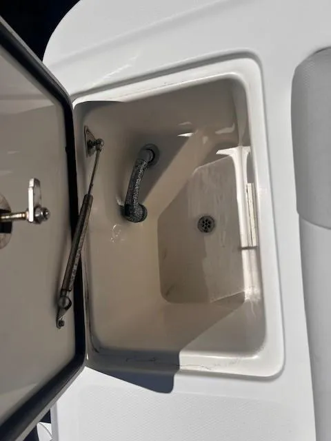 Slide: The Image of Open storage compartment on a 2013 Edgewater 388CC boat. - 31