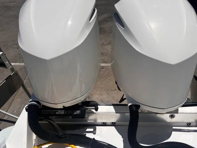 Slide: The Image of Twin outboard motors on a 2013 Edgewater 388CC boat, viewed from above. - 36