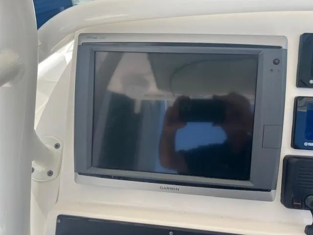 Slide: The Image of Garmin display on 2013 Edgewater 388CC boat dashboard, showing reflection. - 4