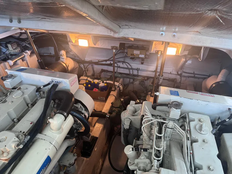 Slide: The Image of Engine room of 2004 Sea Ray 420 Sundancer with visible machinery and components. - 15