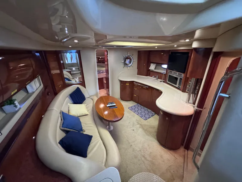 Slide: The Image of Luxurious interior of 2004 Sea Ray 420 Sundancer yacht with elegant seating and modern amenities. - 17