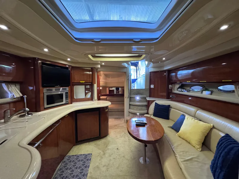 Slide: The Image of Luxurious interior of 2004 Sea Ray 420 Sundancer yacht with elegant seating and modern amenities. - 25