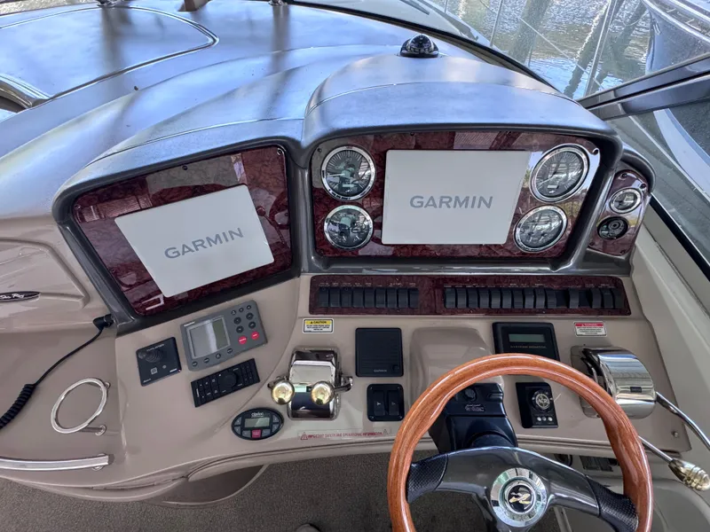 Slide: The Image of Dashboard of 2004 Sea Ray 420 Sundancer with Garmin navigation displays. - 9