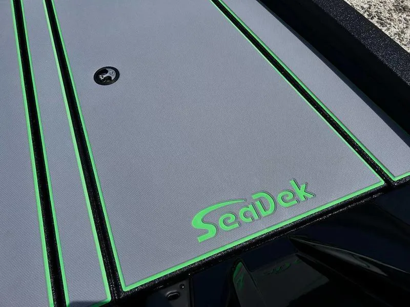Slide: The Image of 2025 Xpress H20 Bass boat with SeaDek flooring, featuring green accents. - 13