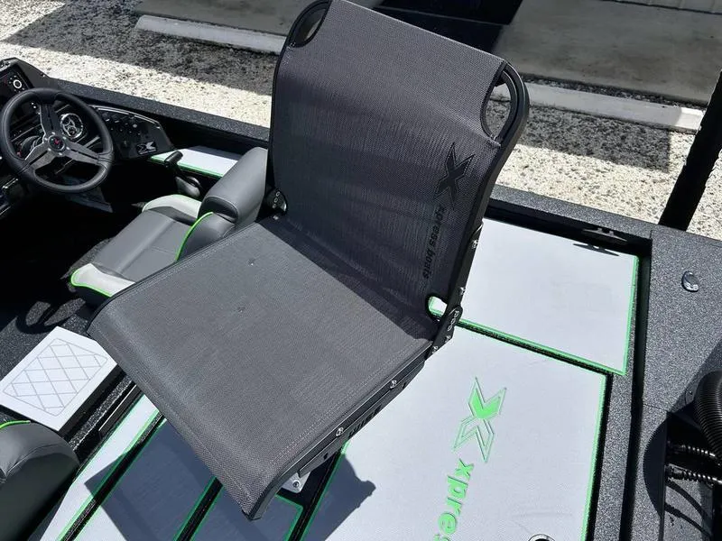 Slide: The Image of 2025 Xpress H20 Bass boat interior with sleek seating and modern design. - 15
