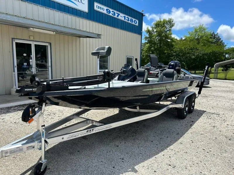 Slide: The Image of 2025 Xpress H20 Bass boat on trailer outside dealership, sunny day. - 4