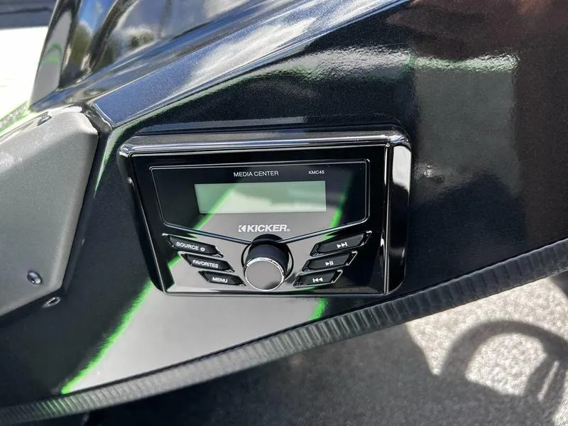 Slide: The Image of 2025 Xpress H20 Bass boat with Kicker media center installed on the dashboard. - 7