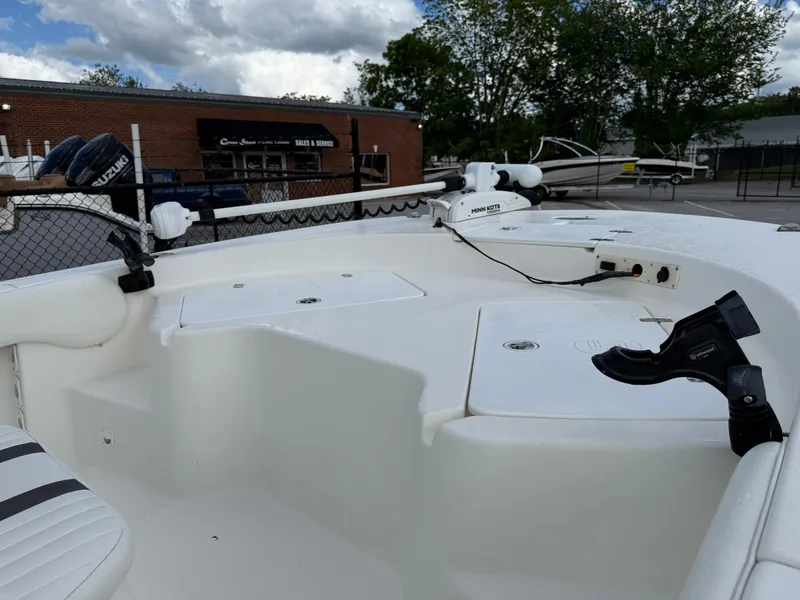 Slide: The Image of 2012 Carolina Skiff 19 Ultra boat deck with seating and storage compartments. - 12