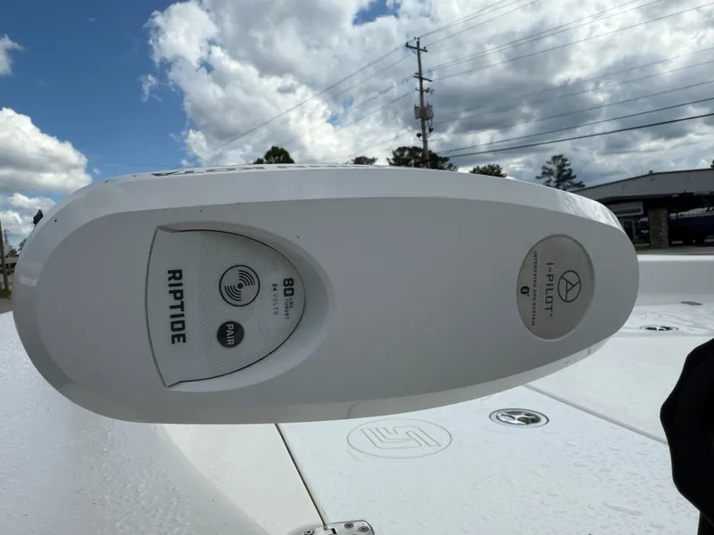 Slide: The Image of Minn Kota Riptide motor on 2012 Carolina Skiff 19 Ultra under cloudy sky. - 14