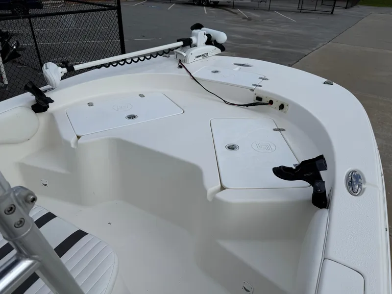 Slide: The Image of 2012 Carolina Skiff 19 Ultra boat deck with storage compartments and seating. - 21