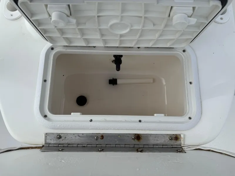 Slide: The Image of Open storage compartment on a 2012 Carolina Skiff 19 Ultra boat. - 24