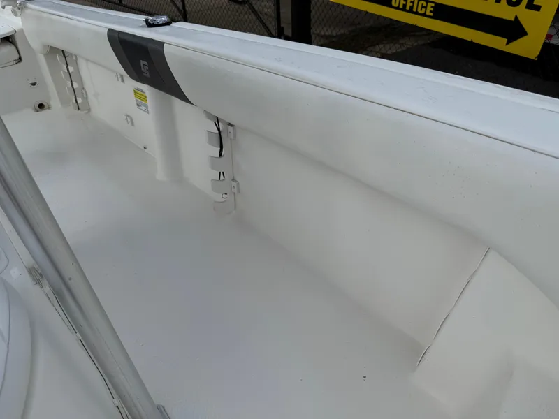 Slide: The Image of 2012 Carolina Skiff 19 Ultra boat interior, featuring white deck and side panel. - 25