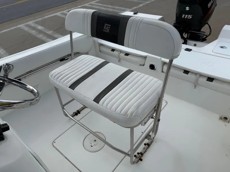 Slide: The Image of 2012 Carolina Skiff 19 Ultra boat seat with white and black upholstery. - 26