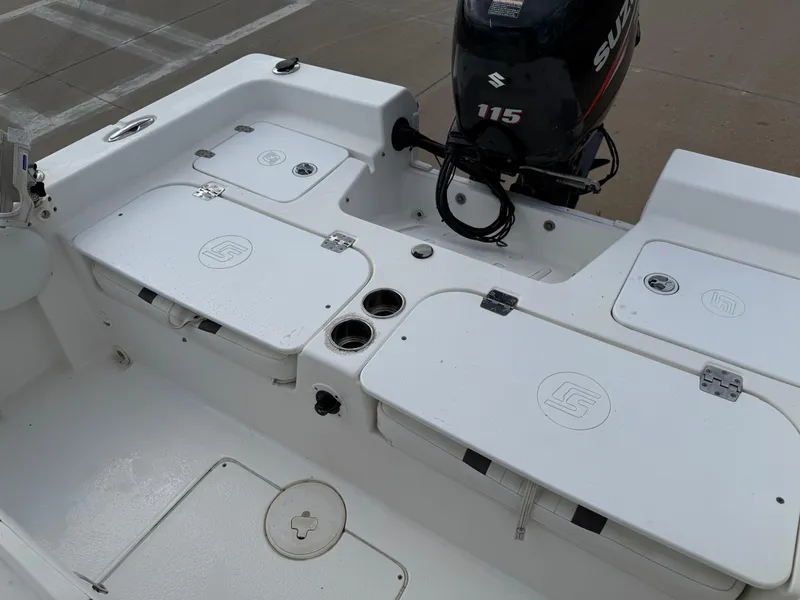 Slide: The Image of 2012 Carolina Skiff 19 Ultra boat interior with Suzuki 115 outboard motor. - 31