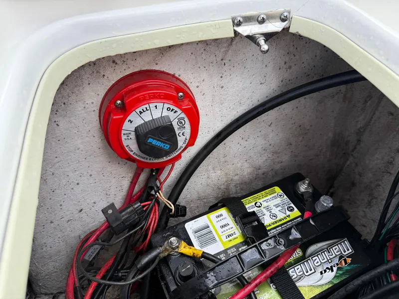 Slide: The Image of Battery compartment of a 2012 Carolina Skiff 19 Ultra with a Perko switch. - 32