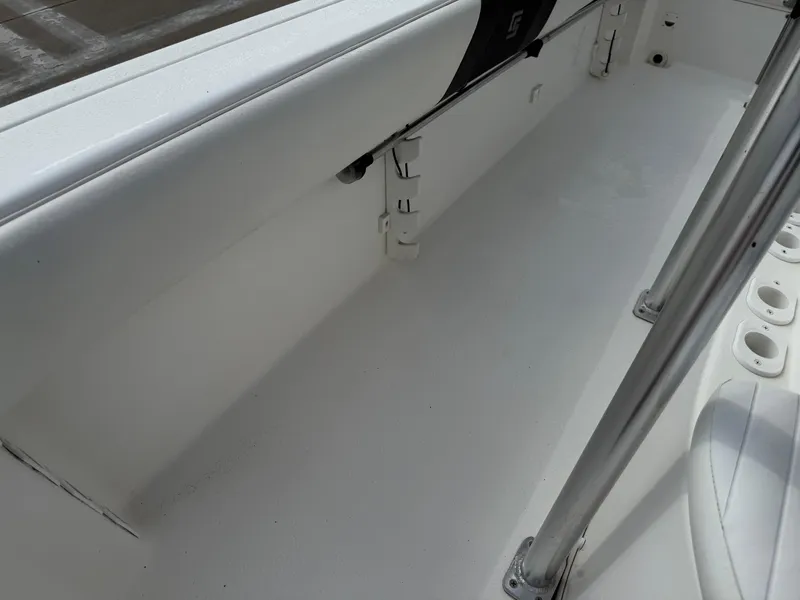 Slide: The Image of 2012 Carolina Skiff 19 Ultra boat interior with white seating and rod holders. - 35