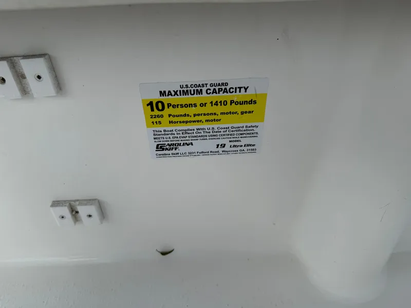 Slide: The Image of Capacity label on 2012 Carolina Skiff 19 Ultra, max 10 people or 1410 pounds. - 36