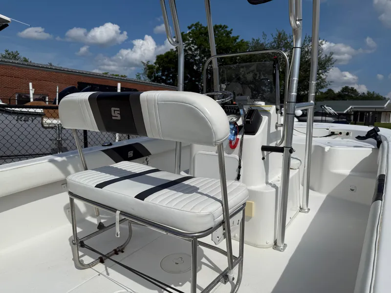 Slide: The Image of 2012 Carolina Skiff 19 Ultra boat interior with seating and steering console. - 38