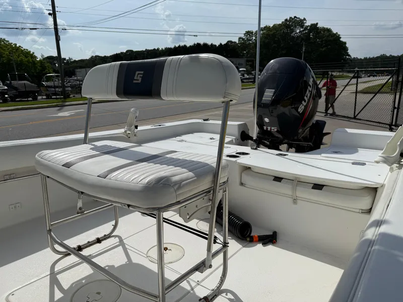 Slide: The Image of 2012 Carolina Skiff 19 Ultra boat interior with seating and outboard motor. - 39