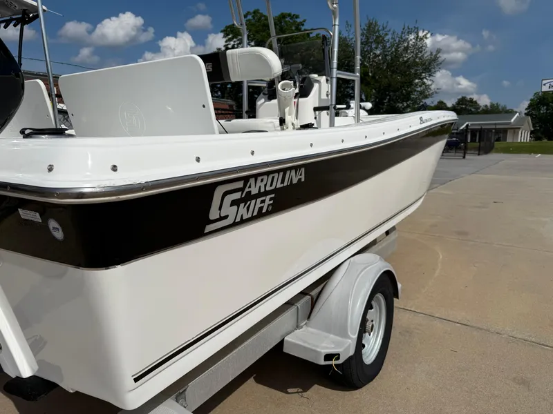 Slide: The Image of 2012 Carolina Skiff 19 Ultra boat on trailer, sunny day, clear sky. - 4