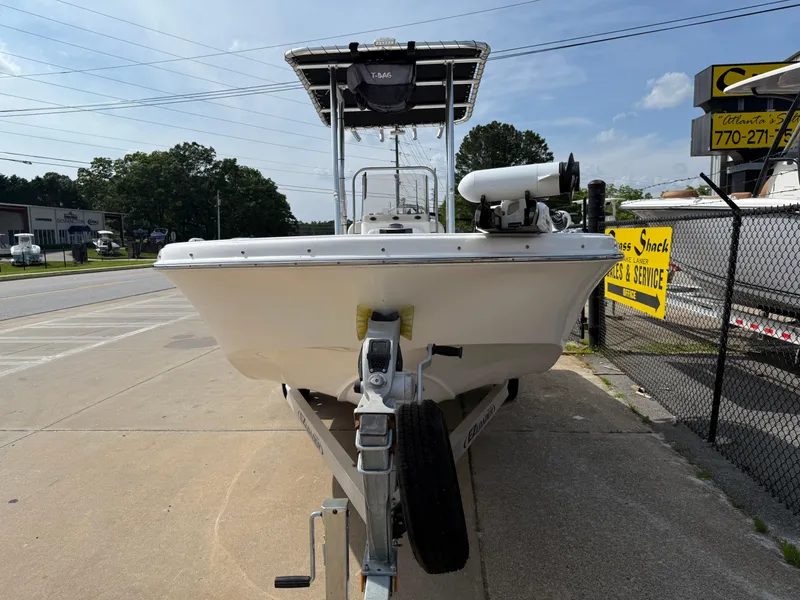 Slide: The Image of 2012 Carolina Skiff 19 Ultra boat on trailer, parked outdoors. - 5
