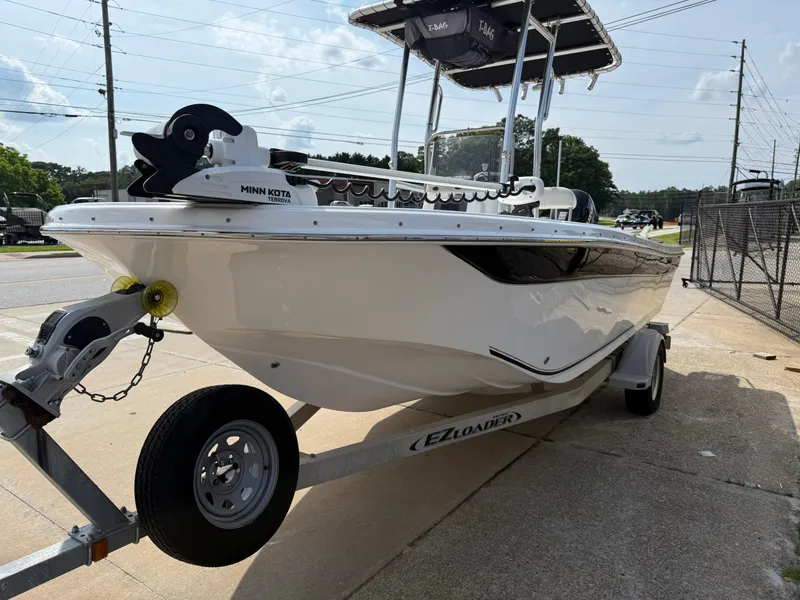 Slide: The Image of 2012 Carolina Skiff 19 Ultra boat on trailer, side view, outdoors. - 6