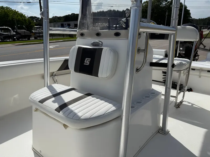 Slide: The Image of 2012 Carolina Skiff 19 Ultra boat interior with seating and console. - 8