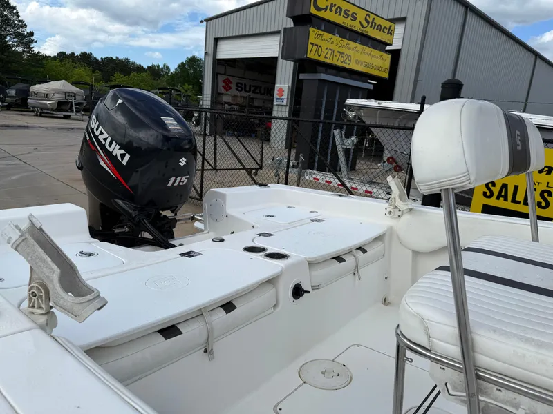 Slide: The Image of 2012 Carolina Skiff 19 Ultra boat with Suzuki 115 engine at dealership. - 9