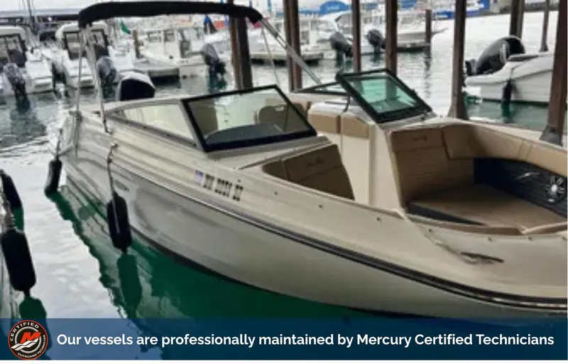 Slide: The Image of 2022 Sea Ray SPX 230 Outboard boat docked, maintained by Mercury Certified Technicians. - 1