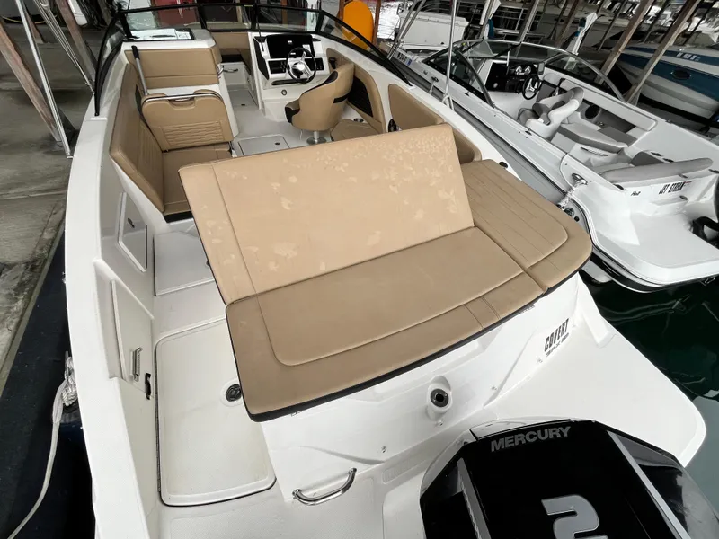 Slide: The Image of 2022 Sea Ray SPX 230 OB boat with tan seating and Mercury outboard engine. - 10