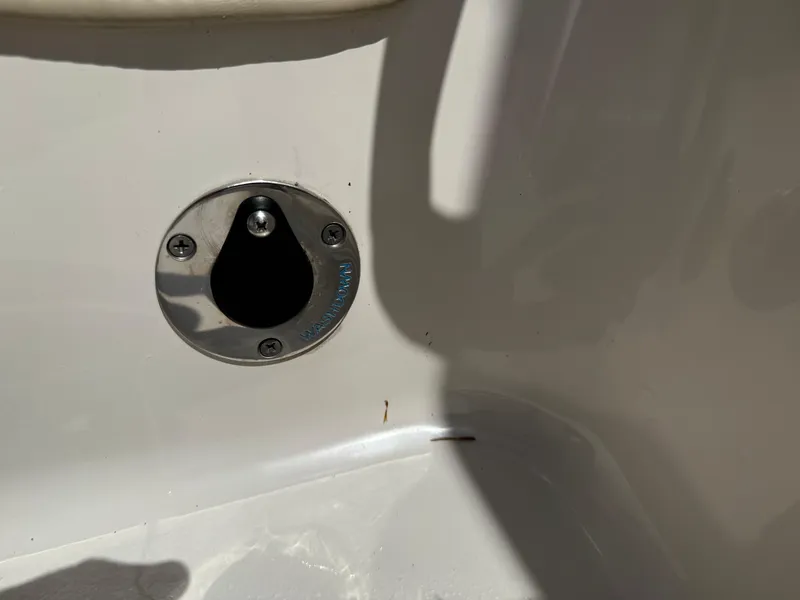 Slide: The Image of 2022 Carolina Skiff 21 LS boat drain plug detail in sunlight. - 17
