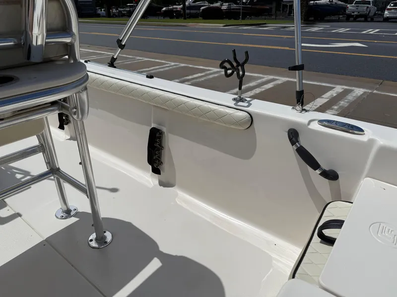 Slide: The Image of 2022 Carolina Skiff 21 LS interior with seating and rod holders. - 21
