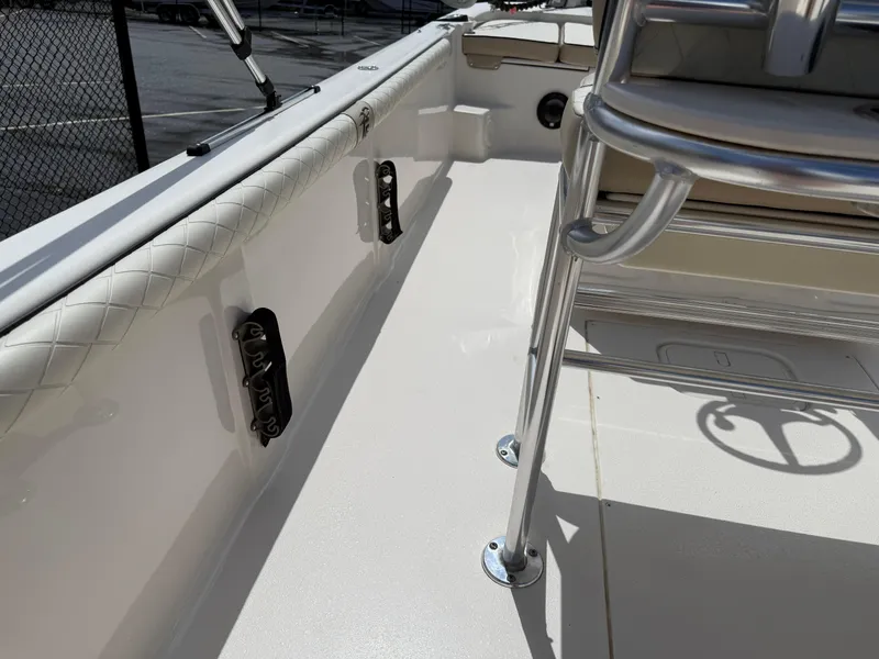 Slide: The Image of 2022 Carolina Skiff 21 LS boat interior with seating and railing details. - 22