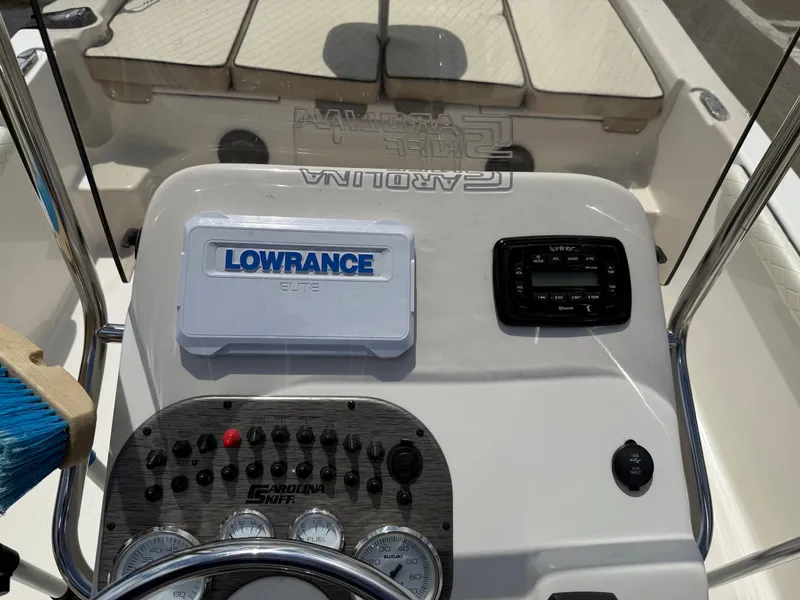 Slide: The Image of 2022 Carolina Skiff 21 LS boat dashboard with Lowrance navigation system. - 26