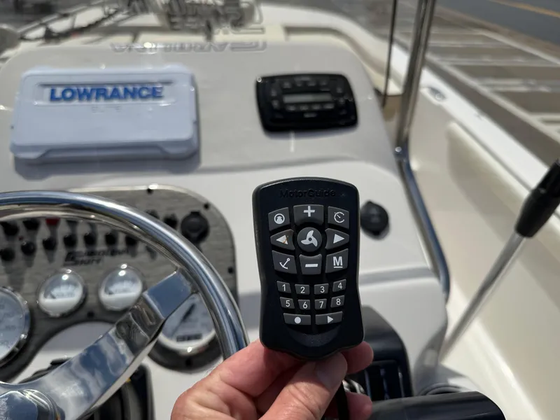 Slide: The Image of 2022 Carolina Skiff 21 LS boat dashboard with Lowrance electronics and control panel. - 28