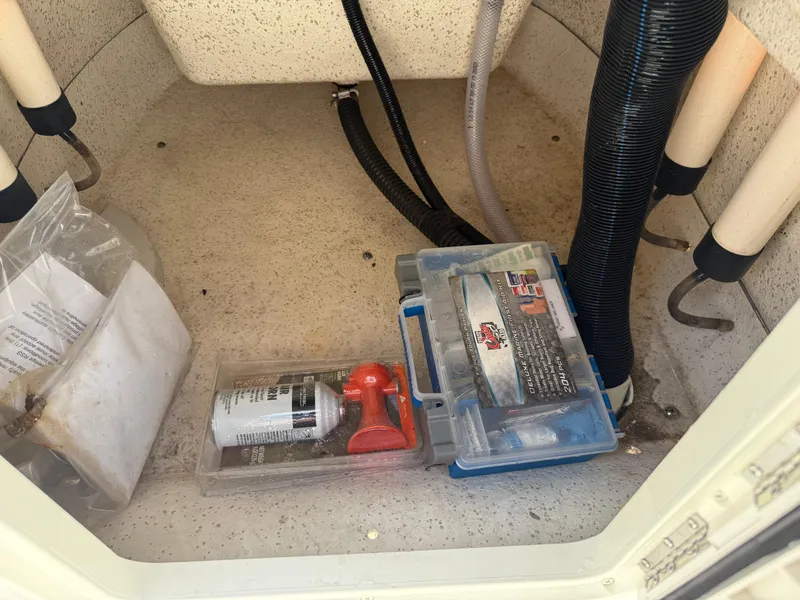 Slide: The Image of Storage compartment of 2022 Carolina Skiff 21 LS with tools and supplies. - 29