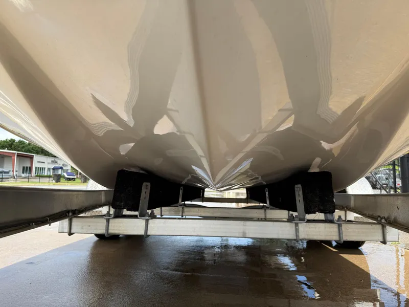 Slide: The Image of 2022 Carolina Skiff 21 LS boat hull on trailer, underside view. - 44