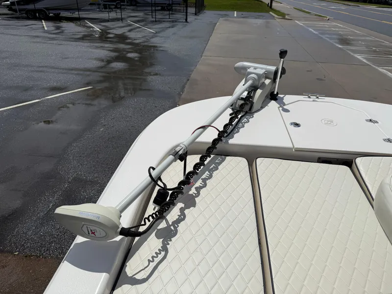 Slide: The Image of 2022 Carolina Skiff 21 LS boat with trolling motor on deck in parking lot. - 9