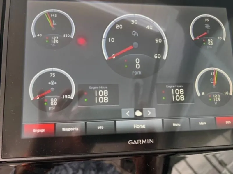 Slide: The Image of Garmin display showing gauges and engine hours on a 2019 Cobalt A40 boat. - 10