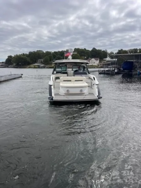 Slide: The Image of 2019 Cobalt A40 boat on a lake under cloudy skies. - 11