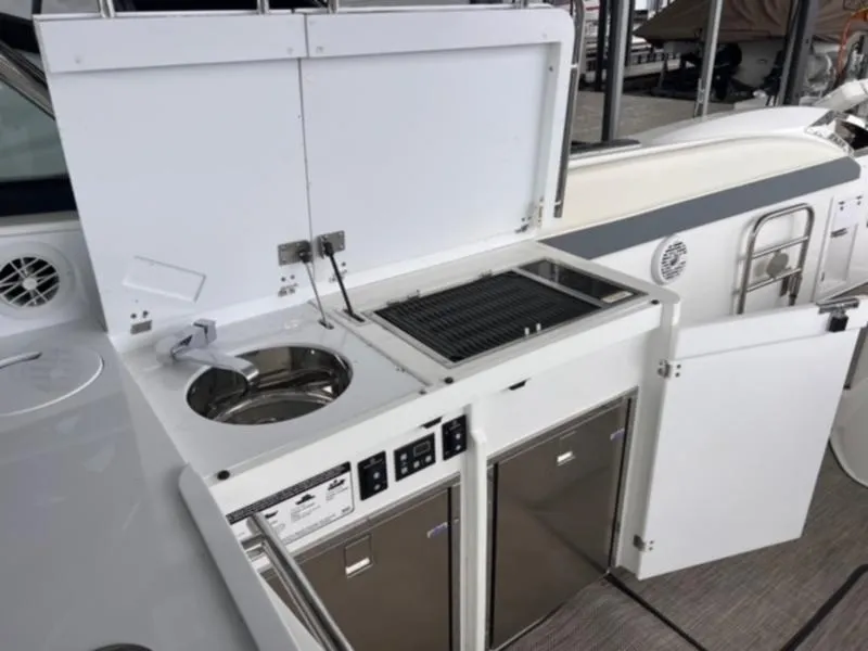 Slide: The Image of Outdoor kitchen on a 2019 Cobalt A40 boat with sink and grill. - 3