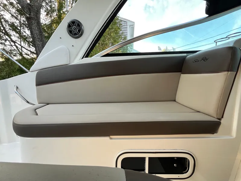 Slide: The Image of 2014 Sea Ray 260 Sundancer interior seating with sleek design and comfortable upholstery. - 21